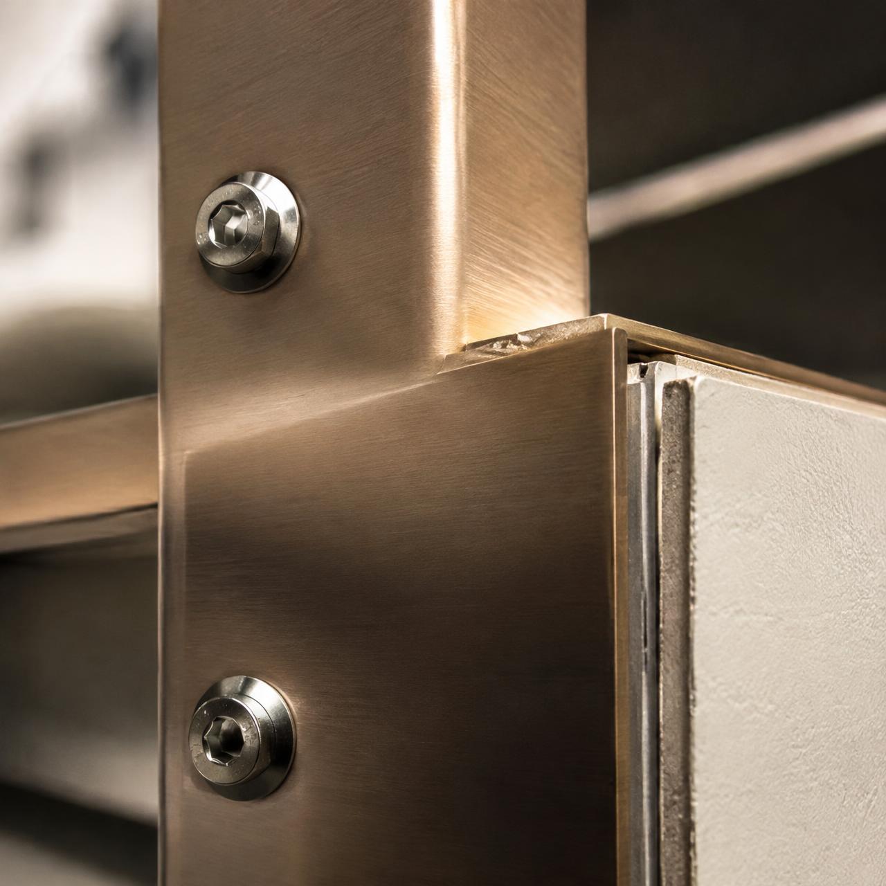 Close-up of a bronze aluminum beam connection